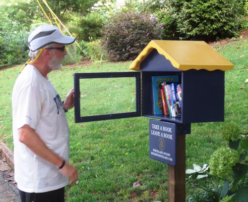 Alan Harvey stops by Tucker'sLittle Free Library.jpg